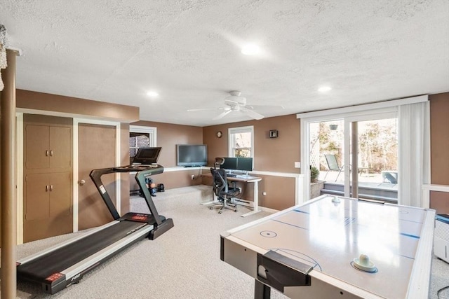 recreation room with a ceiling fan, a textured ceiling, recessed lighting, and carpet