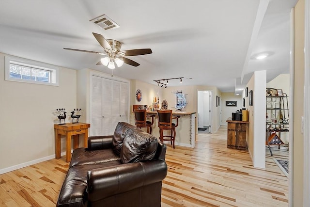 407 Mountain Rd, Jaffrey, NH 03452 - living room featuring rail lighting, baseboards, visible vents, light wood-style floors, and ceiling fan