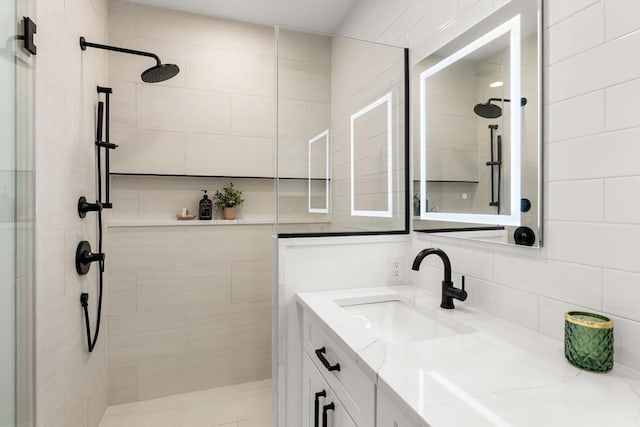 18 Franklin Unit 303A, Salem, MA 01970 - full bathroom featuring tiled shower, vanity, and decorative backsplash
