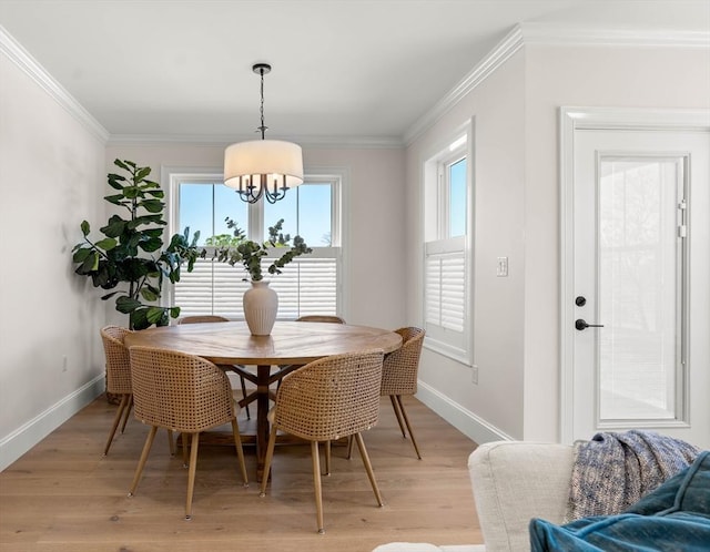 18 Franklin Unit 303A, Salem, MA 01970 - dining room featuring baseboards, a chandelier, light wood-style floors, and crown molding