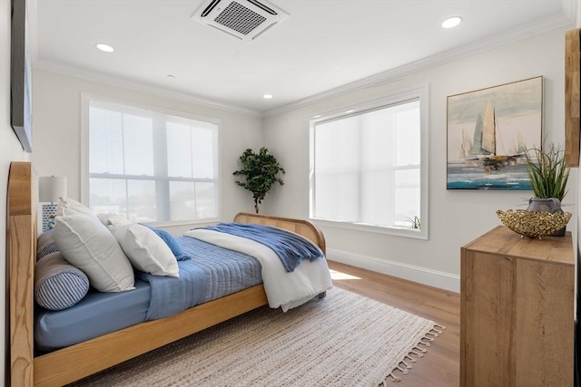 18 Franklin Unit 303A, Salem, MA 01970 - bedroom featuring baseboards, ornamental molding, wood finished floors, and recessed lighting