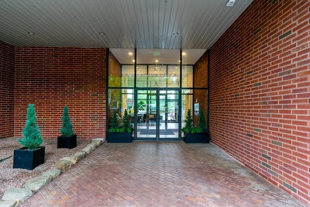 view of exterior entry featuring french doors