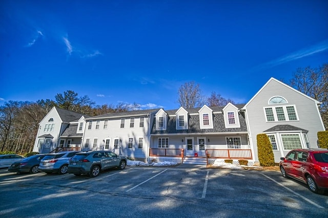 view of property with uncovered parking