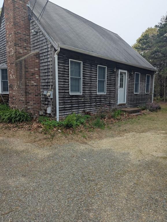 255 Massasoit Rd, Eastham, MA 02642 - view of front of home featuring a chimney