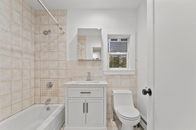 full bathroom featuring vanity, tile walls, shower / bath combination with curtain, toilet, and tile patterned flooring