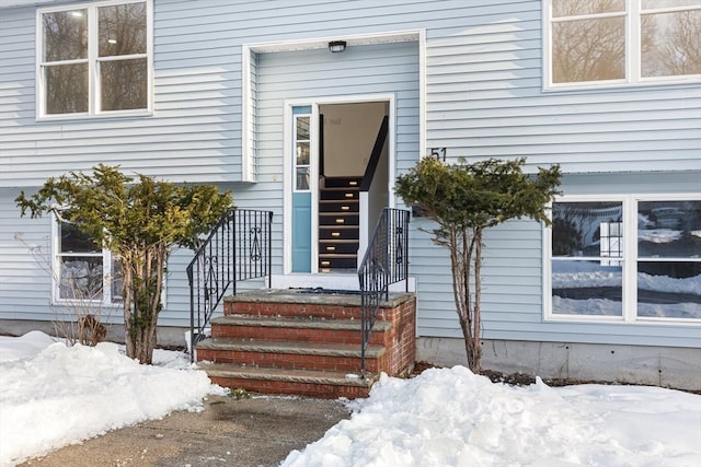 view of snow covered property entrance