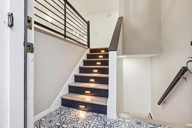 stairs with tile patterned floors