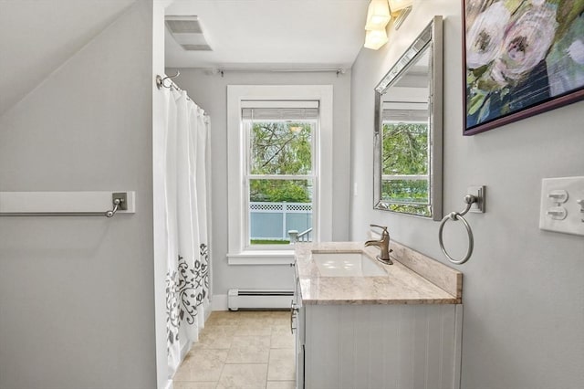 bathroom with a baseboard radiator, vanity, baseboards, tile patterned flooring, and a shower with shower curtain