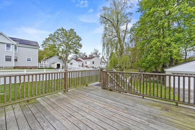 wooden deck with a residential view and an outdoor structure