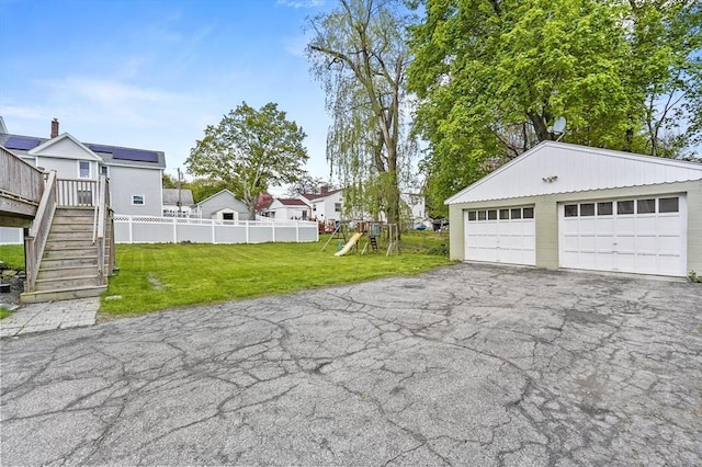 detached garage featuring a residential view