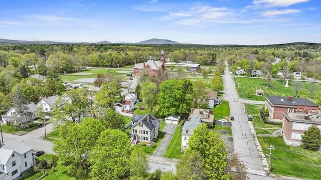 aerial view of residential area featuring a heavily wooded area