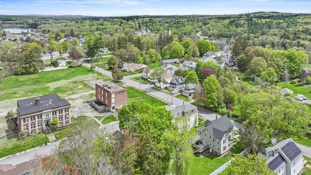 aerial perspective of suburban area featuring a forest