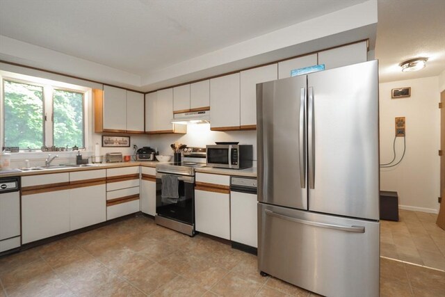 419 Southwick Rd Unit A3, Westfield, MA 01085 - kitchen featuring appliances with stainless steel finishes, under cabinet range hood, white cabinetry, and light countertops