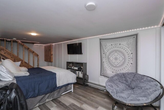 419 Southwick Rd Unit A3, Westfield, MA 01085 - bedroom with wood finished floors and a baseboard heating unit