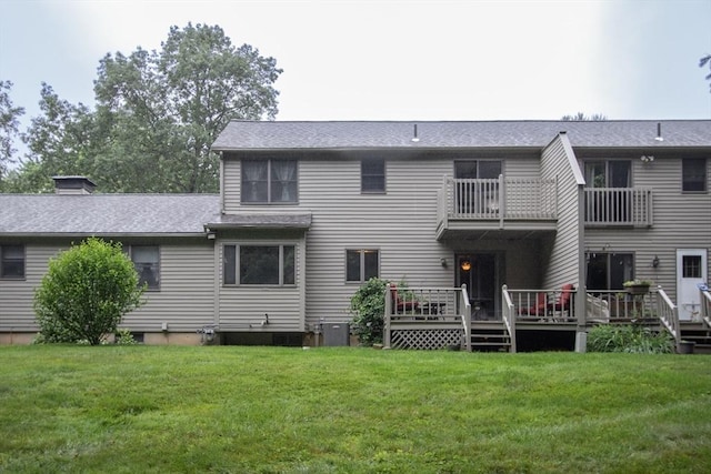 419 Southwick Rd Unit A3, Westfield, MA 01085 - back of house featuring a balcony, a lawn, a shingled roof, a deck, and a chimney