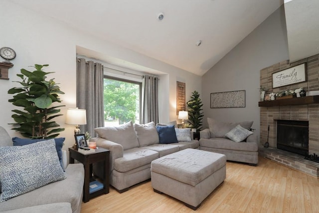 419 Southwick Rd Unit A3, Westfield, MA 01085 - living area with light wood-style floors, high vaulted ceiling, and a fireplace