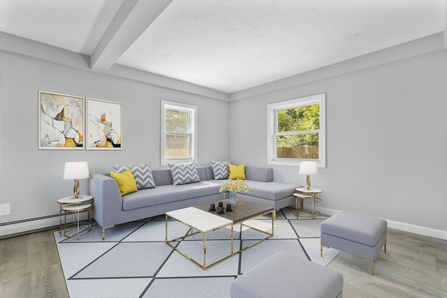 living room with beam ceiling, baseboards, a baseboard radiator, and wood finished floors