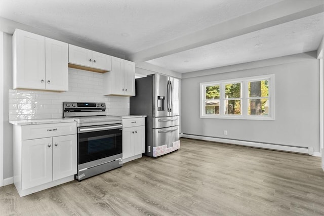 kitchen with light wood-style floors, white cabinetry, a baseboard heating unit, light countertops, and stainless steel appliances
