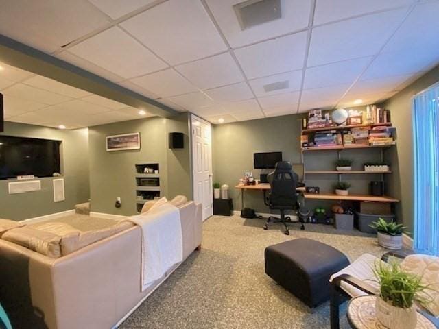 carpeted home office with a paneled ceiling and baseboards