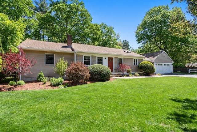 ranch-style home with a chimney, a garage, a front yard, and concrete driveway