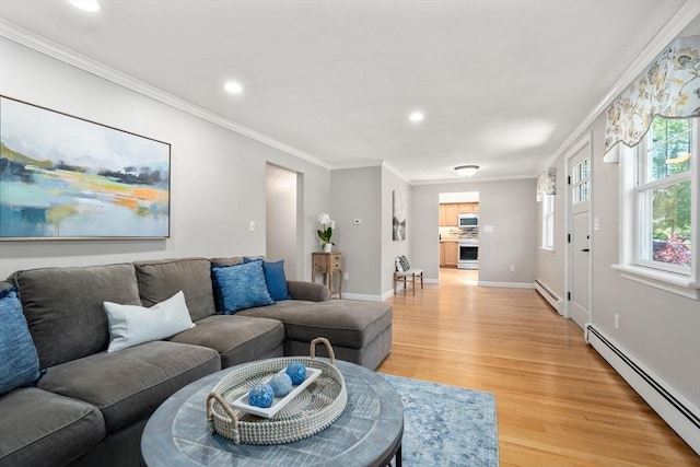 living area with a baseboard heating unit, light wood-style flooring, crown molding, recessed lighting, and baseboards