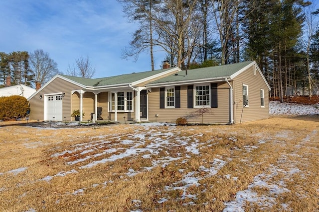 ranch-style house with a garage and a porch