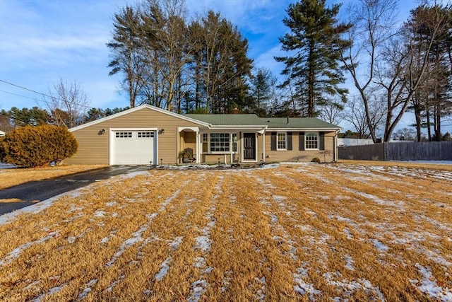 ranch-style home featuring a garage