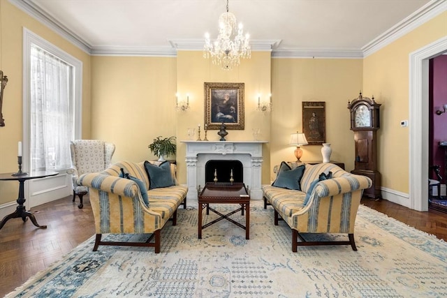 sitting room featuring a chandelier, ornamental molding, a fireplace, and baseboards