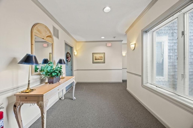 hall featuring dark carpet and ornamental molding