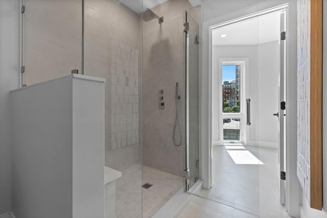 bathroom with a shower with shower door