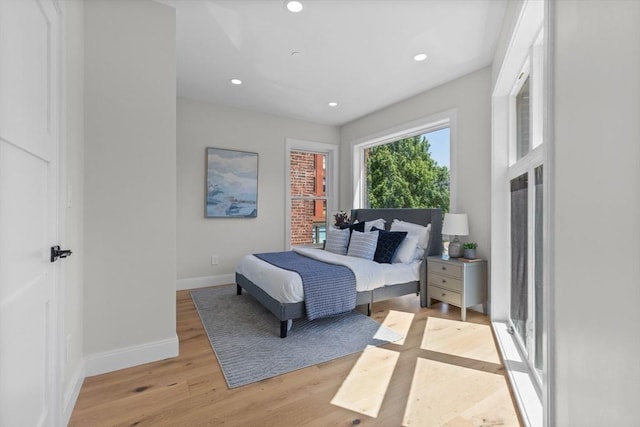 bedroom with light hardwood / wood-style floors