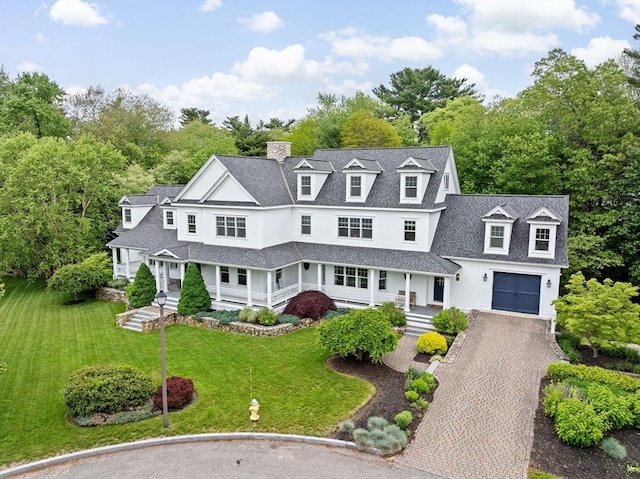 54 Garrison Dr, Scituate, MA 02066 - shingle-style home featuring a porch, decorative driveway, a chimney, and a front lawn