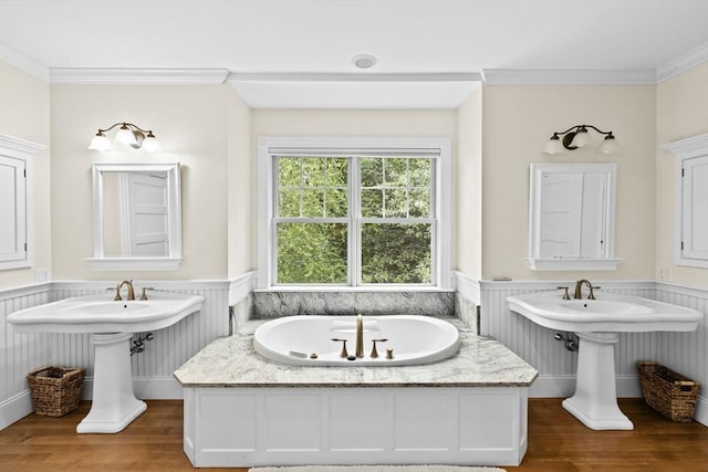 54 Garrison Dr, Scituate, MA 02066 - bathroom with a wainscoted wall, wood finished floors, a garden tub, and ornamental molding