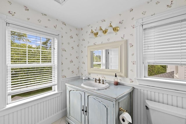 54 Garrison Dr, Scituate, MA 02066 - bathroom with wallpapered walls, a wainscoted wall, toilet, and vanity