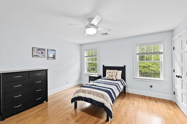 54 Garrison Dr, Scituate, MA 02066 - bedroom with baseboards, light wood finished floors, and ceiling fan