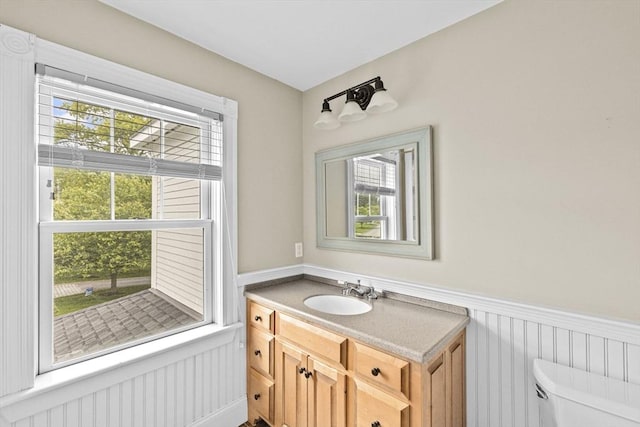 54 Garrison Dr, Scituate, MA 02066 - bathroom featuring wainscoting, vanity, and toilet