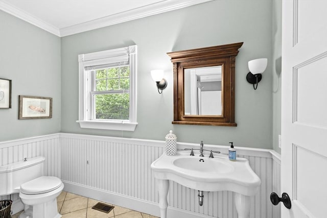 54 Garrison Dr, Scituate, MA 02066 - half bath featuring wainscoting, toilet, tile patterned flooring, and crown molding