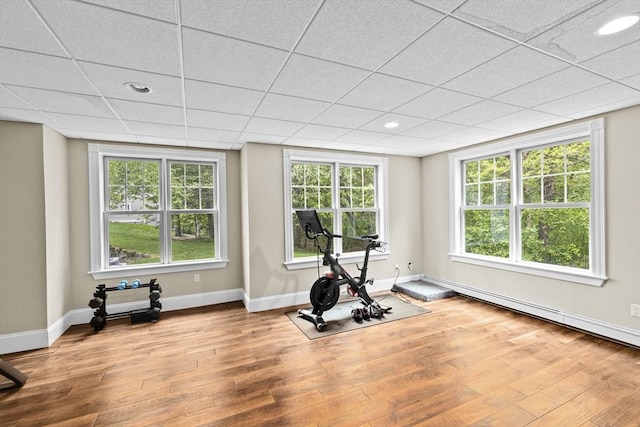 54 Garrison Dr, Scituate, MA 02066 - workout room featuring wood finished floors, baseboards, plenty of natural light, recessed lighting, and a baseboard radiator