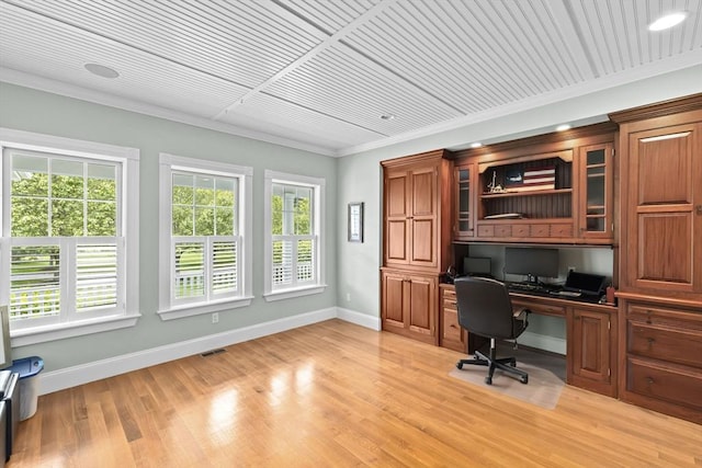 54 Garrison Dr, Scituate, MA 02066 - home office featuring built in desk, baseboards, crown molding, and light wood finished floors