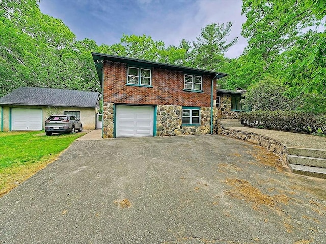 18 Shady Oak Dr, Mattapoisett, MA 02739 - split level home with stone siding, asphalt driveway, and an attached garage