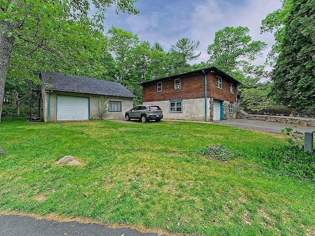 18 Shady Oak Dr, Mattapoisett, MA 02739 - view of home's exterior featuring asphalt driveway, an attached garage, a lawn, and brick siding