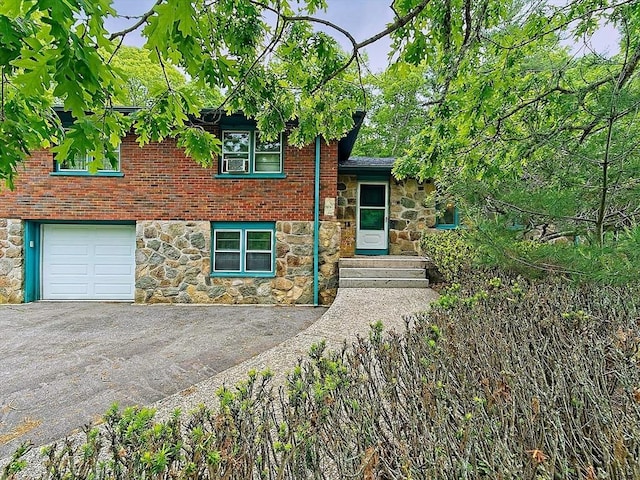 18 Shady Oak Dr, Mattapoisett, MA 02739 - split level home featuring stone siding, a garage, asphalt driveway, and brick siding