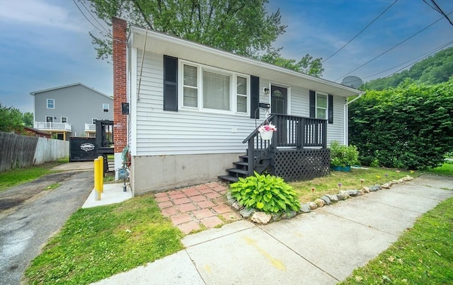 83 Armstrong St, West Springfield, MA 01089 - bungalow-style home featuring a chimney and covered porch