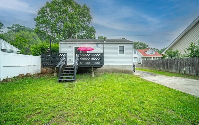 83 Armstrong St, West Springfield, MA 01089 - rear view of house with a wooden deck