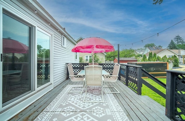 83 Armstrong St, West Springfield, MA 01089 - wooden terrace featuring outdoor dining area and a storage shed