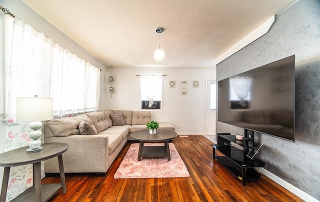 83 Armstrong St, West Springfield, MA 01089 - living room with dark wood-type flooring and baseboards