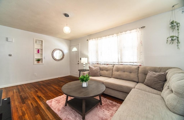 83 Armstrong St, West Springfield, MA 01089 - living room with dark wood-style floors and built in shelves