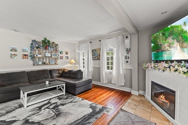 47-49 Dean St, Norton, MA 02766 - living area featuring a glass covered fireplace and light wood-style floors