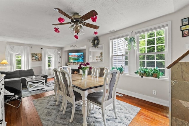47-49 Dean St, Norton, MA 02766 - dining room featuring a ceiling fan, hardwood / wood-style floors, and a textured ceiling