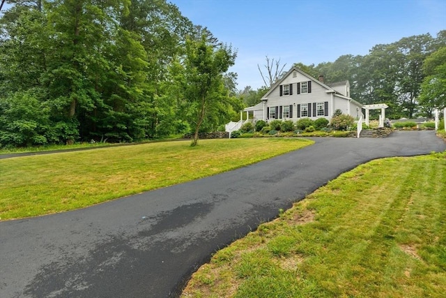 47-49 Dean St, Norton, MA 02766 - view of front of house featuring asphalt driveway, a front yard, and a chimney